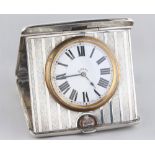 Property of a gentleman - an early 20th century silver cased folding travel clock, the case with