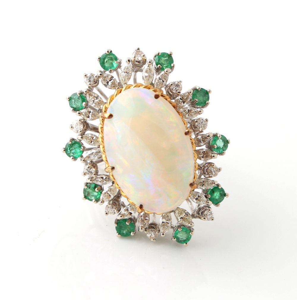 Property of a gentleman - an opal diamond & emerald ring, the large oval opal measuring