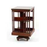 Property of a deceased estate - an Edwardian mahogany two-tier revolving bookcase, 19.5ins. (49.