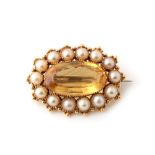 Property of a lady - a Victorian yellow gold citrine & pearl oval brooch, the oval cut citrine