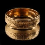 Property of a deceased estate - a late Victorian 18ct gold wedding band with engraved foliate