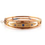Property of a deceased estate - an Edwardian 9ct gold hinged bangle set with two small diamonds &