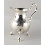 Property of a gentleman - a large George II silver baluster cream jug, of good grade, raised on hoof