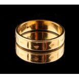 Property of a lady - an 18ct yellow gold wedding band, with cut decoration, approximately 4.2 grams,