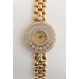 Property of a lady - a lady's Chopard 18ct yellow gold cased 'Happy Diamonds' wristwatch, in