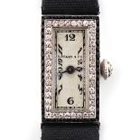 An early 20th century Tiffany & Co. platinum rectangular cased lady's wristwatch, with diamond &