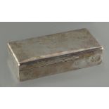 Property of a gentleman - a silver rectangular cigarette box with engraved presentation inscription,