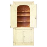 Property of a gentleman - a George III painted pine architectural corner cabinet, with vaulted