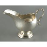 Property of a deceased estate - a silver helmet shaped cream jug, Edward Barnard & Sons, London
