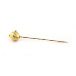 Property of a lady - a Victorian unmarked yellow gold stickpin with engraved ball terminal set