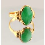 A Chinese high carat yellow gold oval jadeite ring, Chinese marks to shank, size K (see