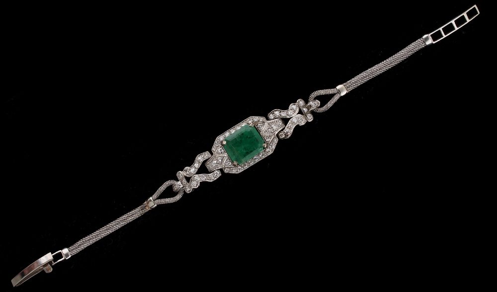 Property of a gentleman - an emerald & diamond bracelet, the octagonal cut emerald measuring