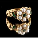 A Georgian emerald & seed pearl flowerhead cluster ring, the pierced scrolling shoulders set with
