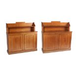 Property of a gentleman - a pair of early 20th century mid oak chiffoniers, enclosing adjustable