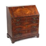 Property of a gentleman - an early 18th century walnut fall-front bureau, with fitted interior above