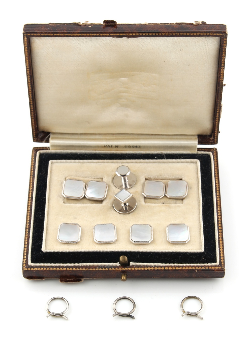 Property of a lady - a cased set of 9ct white gold & mother-of-pearl cufflinks, buttons & studs (one