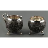 Property of a deceased estate - a carved coconut & white metal mounted cream jug and matching