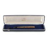 Property of a lady - a Dunhill 18ct yellow gold cigarette holder, French marks, with black plastic