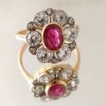 A certificated Burmese ruby & diamond flowerhead cluster ring, the oval cut ruby weighing 1.40
