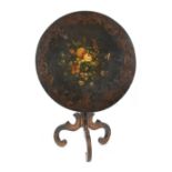 Property of a lady - an early Victorian floral decorated black papier mache circular tilt-top table,