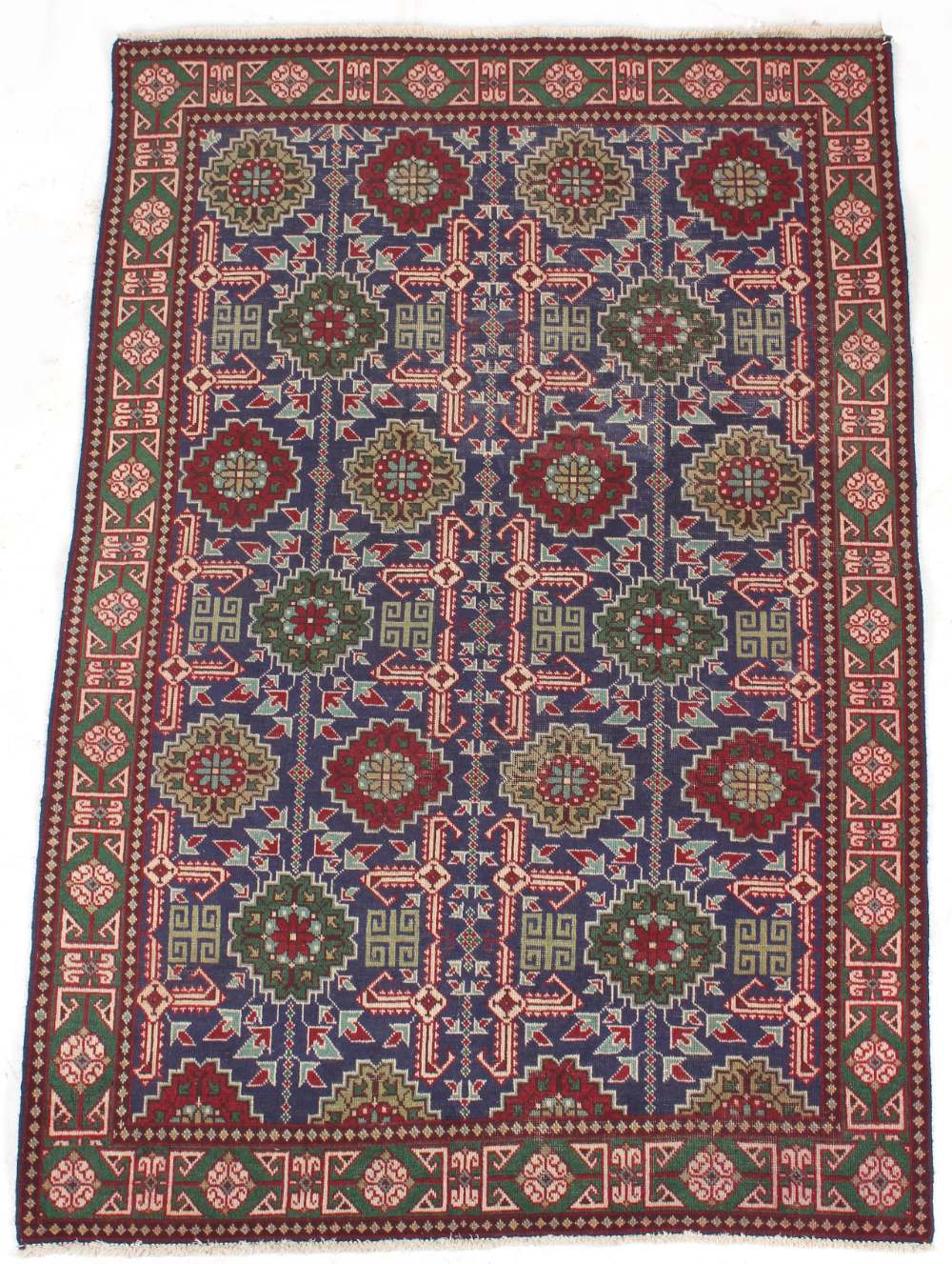 A Tabriz woollen hand-made rug with blue ground, 58 by 39ins. (147 by 99cms.) (see illustration)