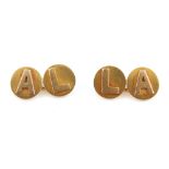 Property of a lady - a pair of unmarked yellow gold (tests 22ct) cufflinks, each with two circular