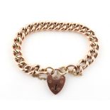 Property of a lady - a 9ct gold chain bracelet with heart shaped lock clasp, with safety chain,