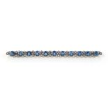A sapphire & diamond stock pin, set with eleven clear vivid blue round cut sapphires in collet