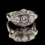 An Art Deco style white gold diamond ring, with a row of three round brilliant cut diamonds in