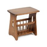 Property of a lady - an Ercol occasional table with magazine rack under, 21.5ins. (54.5cms.) wide (