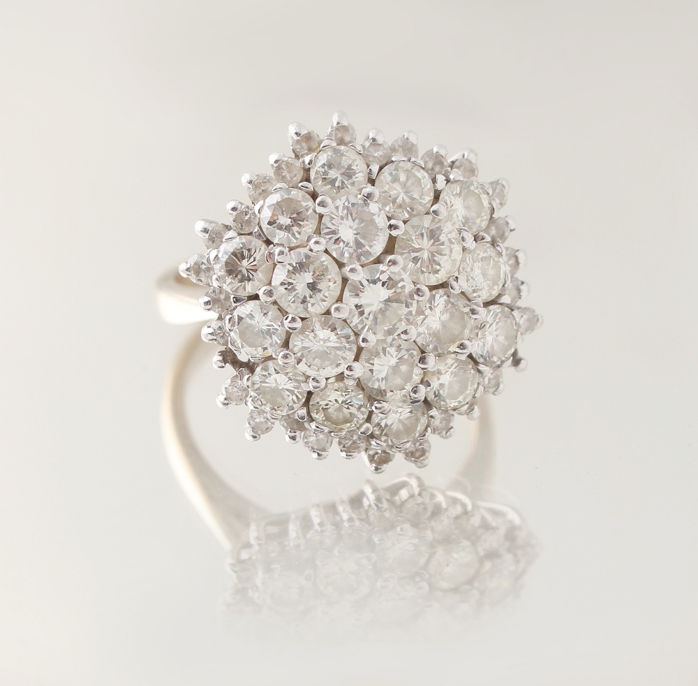 Property of a lady - an 18ct white gold diamond cluster ring, the estimated total diamond weight 2.