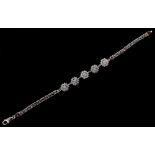 Property of a lady - a 9ct white gold diamond bracelet, of flattened chain link form with five