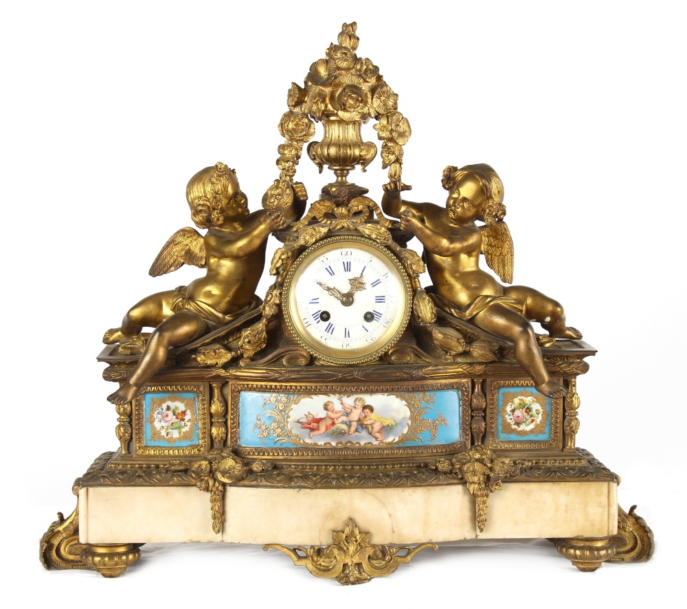 Property of a gentleman - a 19th century French porcelain mounted ormolu mantel clock, decorated