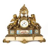 Property of a gentleman - a 19th century French porcelain mounted ormolu mantel clock, decorated