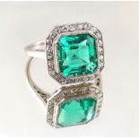 A very fine certificated Colombian emerald & diamond ring, the transparent vivid green octagonal cut