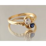 An early 20th century 18ct yellow gold sapphire & diamond two stone crossover ring, the stones in