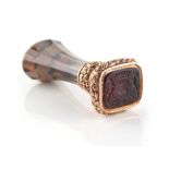 Property of a lady - a good 19th century unmarked gold & smoky quartz desk seal, the carved intaglio