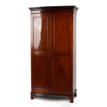 Property of a deceased estate - an Edwardian mahogany bow-fronted panelled two-door wardrobe, on
