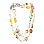 An unusual yellow gold & multi gem set opera necklace, the variously coloured gems of various