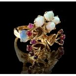 Property of a lady - an unmarked high carat gold (tests 18-22ct) ring of modern floral design, set