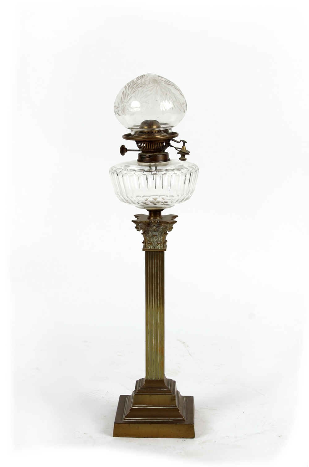 Property of a deceased estate - an Edwardian brass square Corinthian column paraffin oil lamp with