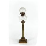 Property of a deceased estate - an Edwardian brass square Corinthian column paraffin oil lamp with