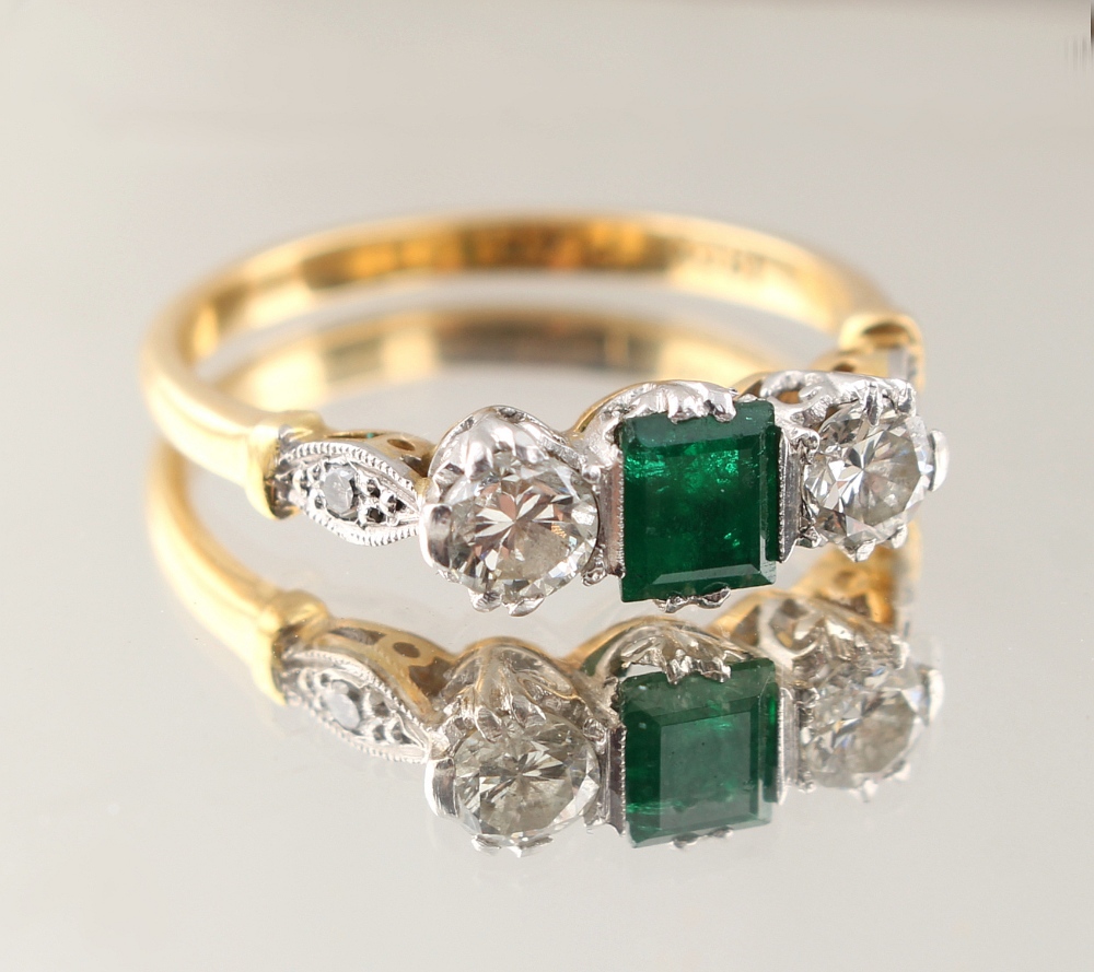 Property of a deceased estate - an 18ct yellow gold & platinum emerald & diamond three stone ring,