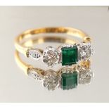 Property of a deceased estate - an 18ct yellow gold & platinum emerald & diamond three stone ring,