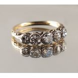 Property of a lady - an unmarked yellow gold five stone diamond ring, with scroll setting, the