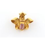 A 19th century yellow gold & topaz buckle brooch, with chased scrolling leaf decoration, the