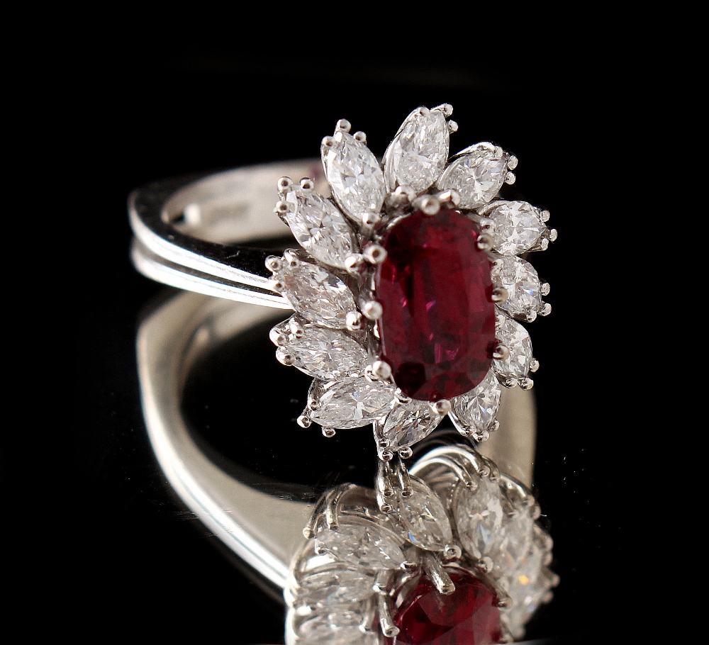 An 18ct white gold ruby & diamond floral cluster ring, the oval cushion cut ruby weighing - Image 2 of 2