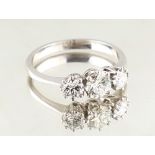 A diamond three stone ring, the three round brilliant cut diamonds weighing a total of approximately