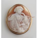 Property of a lady - a large oval shell cameo brooch depicting a lady wearing an Ottoman style