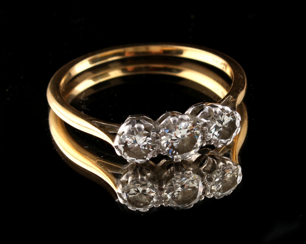 Property of a deceased estate - n 18ct yellow gold diamond three stone ring, the brilliant cut